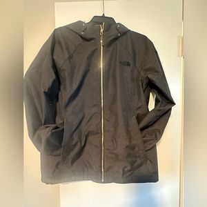 The north face charcoal grey with gold zipper rain jacket